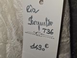 a label on a dress with a price tag attached to it