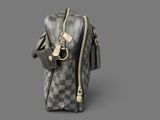 a grey and black checkered bag on a gray background