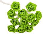a bunch of green flowers that are on a white table