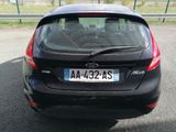 a black car parked on the side of the road