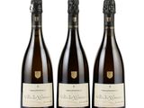 three bottles of wine sitting next to each other on a white surface