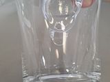 a person that is holding a glass with a liquid in it