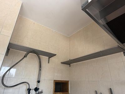 a picture of a bathroom with a sink and a shower head