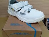 a white shoe that is on top of a box