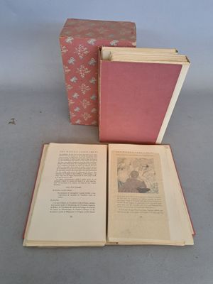 two open books sitting on a table next to each other