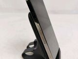 a cell phone that is sitting on a stand