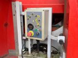 a machine that is sitting in the back of a truck