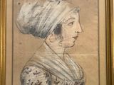 an old drawing of a woman in a turban in a gold frame