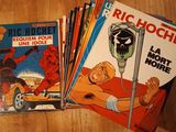 several comics are stacked on top of each other on a table