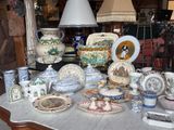 a table with many different types of china on it