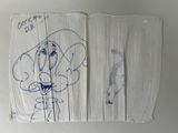 a piece of paper with a drawing of a dog on it