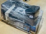 a pile of computer equipment wrapped in plastic on a pallet