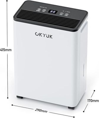 a white air conditioner sitting on top of a white table