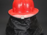 a red hard hat sitting on top of a black bag