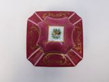 a red box with a picture of a flower on it