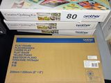 a box of printer paper sitting on a table next to a box of printer paper
