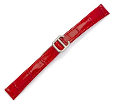 un gros plan d'un bracelet de montre rouge sur fond blanc