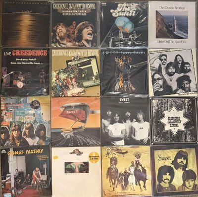 a lot of records on the wall of a room