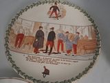a plate with a painting on it and a plate with a painting on it