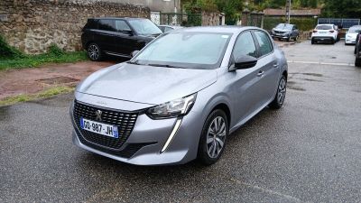 a silver car that is parked on the side of the road