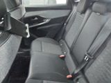 the back seats of a car are black and grey in color