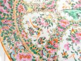 a plate with a floral design on it sitting on a table