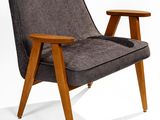 an image of a grey chair with a wooden leg and arm rest