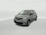 the grey car is parked in a white room with a white wall