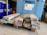 a pile of cement blocks on a pallet in a warehouse