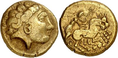a gold coin with an image of a woman on it