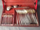 a red case with silverware in it on a table