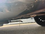 a close up of a car ' s exhaust pipe and exhaust pipe