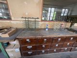 an old wooden cabinet in a room with many drawers