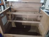 a small oven that is sitting in the middle of a room