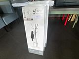 a sign that says 5 five on it in front of a desk