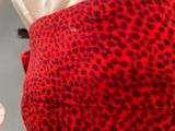 a close up of a red and black leopard print skirt