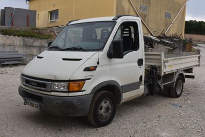 a white truck that is parked in front of a building