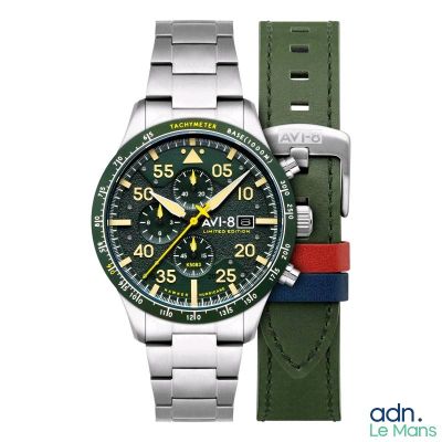 une photo d'une montre avec un cadran vert et un bracelet rouge et bleu