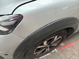 a close up of a car ' s front tire with a sticker on it