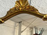 a mirror hanging on the wall in the room
