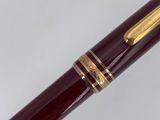 an image of a person holding a pen in their hand