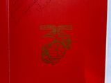 a red book with a us marine emblem on it