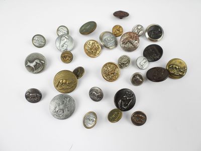 a bunch of buttons sitting on top of a white surface