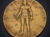 a close up of a gold medal on a black background