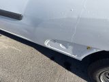 a white van that is parked on the side of the road