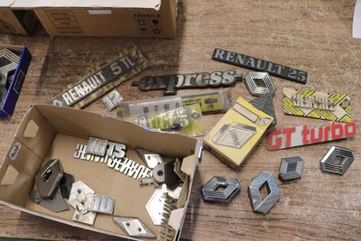a box full of assorted metal items on a table