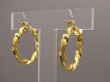 gold plated hoop earrings with a snake design