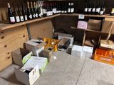 many bottles of wine on the shelves in the store