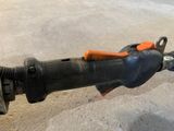a close up of a pipe cutter on the ground