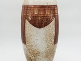 a brown and white vase on a white background
